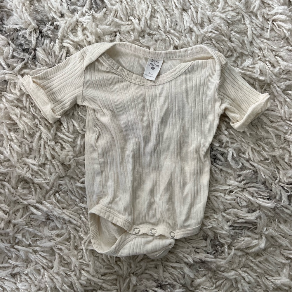 Kate Quinn onesie